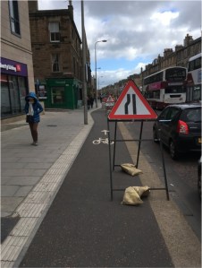 photo of sign blocking cycle-path on Leith Walk in 2018